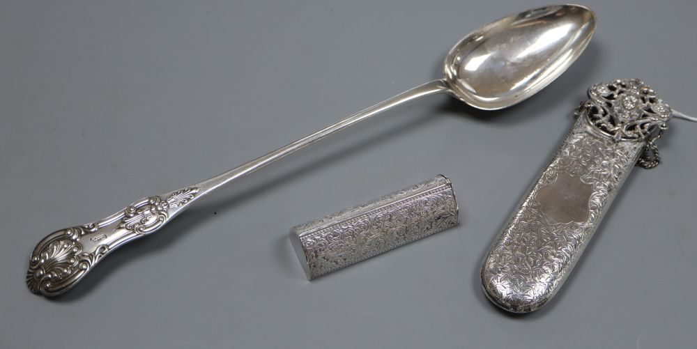 A late Victorian silver spectacles case with chatelaine clip, Birmingham, 1900, one other case? and a plated basting spoon.